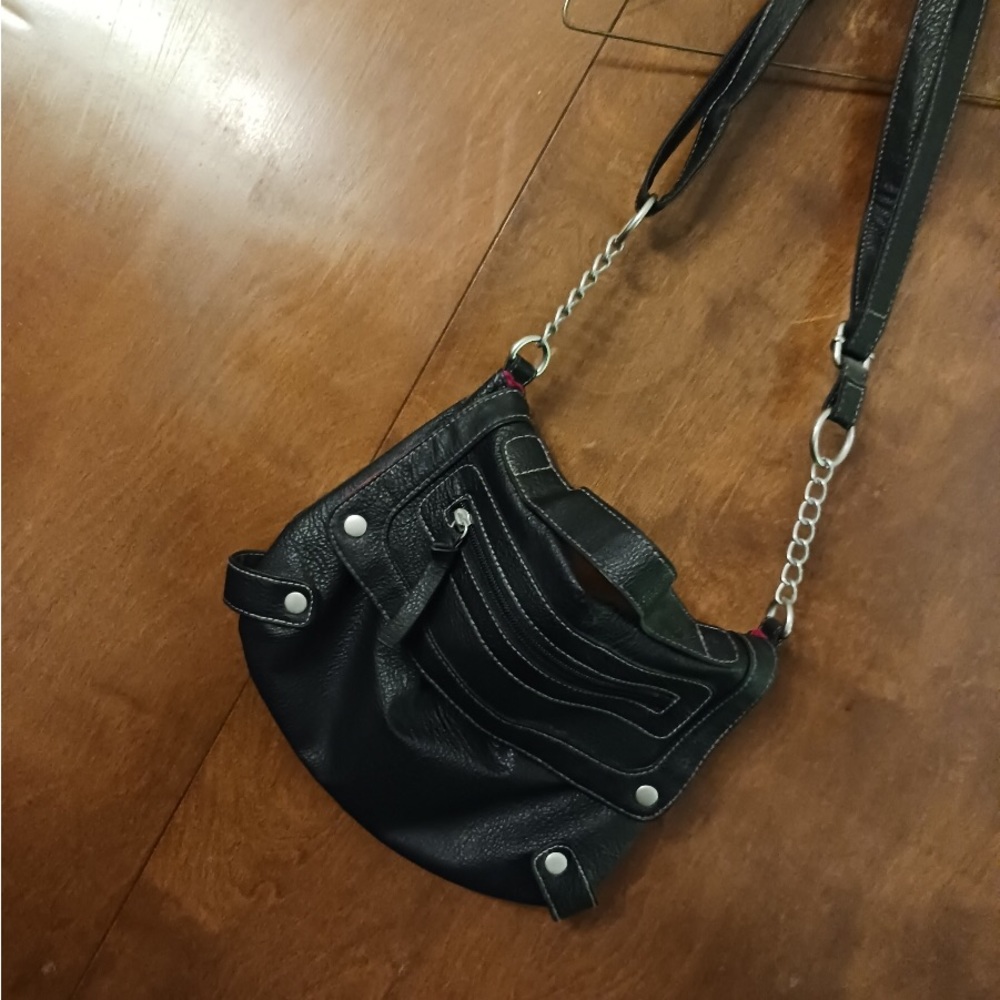 Like new black pocketbook with adjustable shoulder strap.